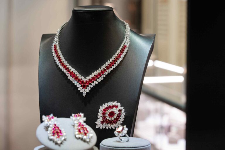 Artistic enamel statement necklace displayed in a showcase at Jewellery & Gem Fair Taiwan 2026.